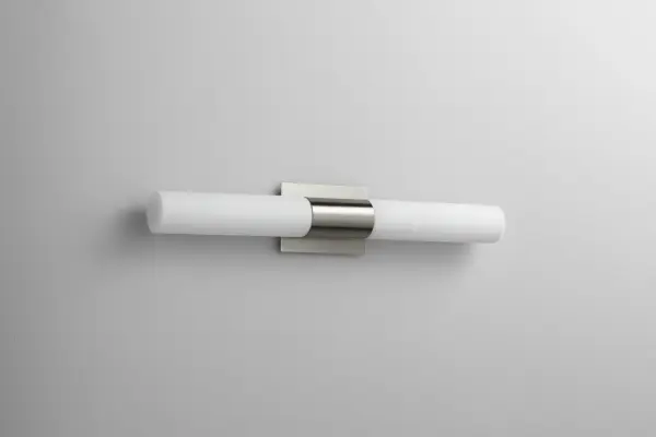 The Magneta LED vanity light combines sleek contemporary styling with integrated LED technology. Its 27-inch width and matte opal glass provide even, flattering illumination ideal for bathroom vanities and grooming areas.