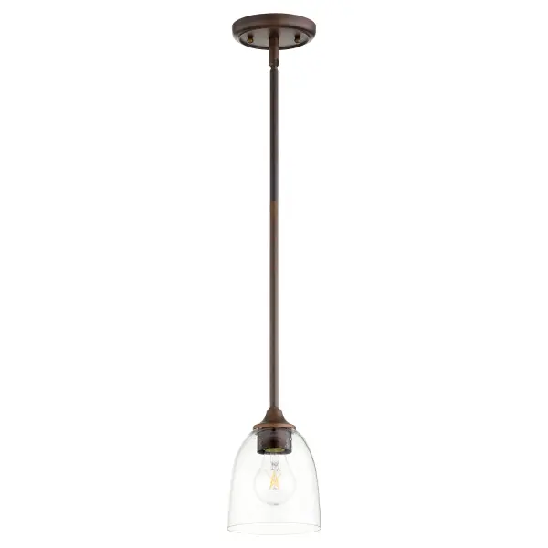 The Jardin mini pendant combines intricate finials and soft curves with an oiled bronze finish and clear seeded glass shade. Its refined yet approachable design offers versatility for various spaces.