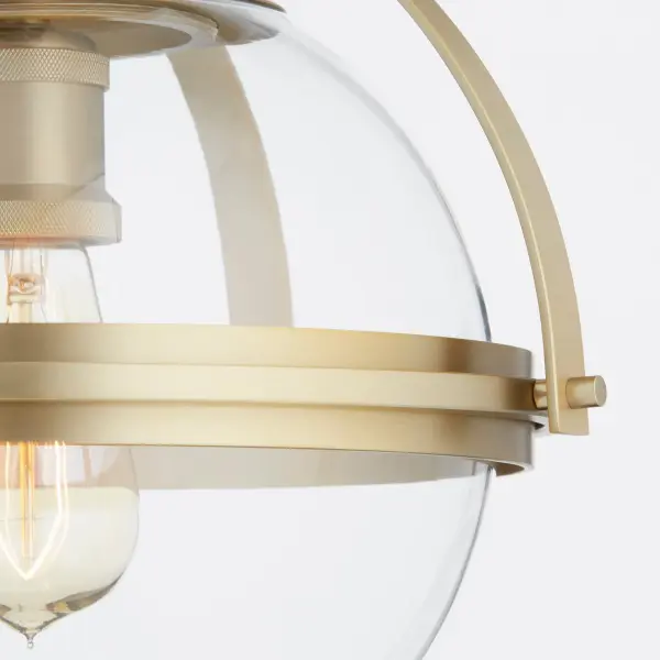 This 12-inch ceiling mount beautifully blends traditional warmth with modern simplicity. The round glass globe is enhanced by striking aged brass bands, creating a sophisticated look perfect for smaller spaces. - alternate view