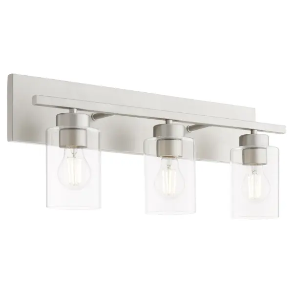 The Carter 3-Light Vanity combines contemporary design with versatile customization. Its rectangular backplate and thin arms create a sleek profile, while included socket decos in three finishes let you adapt the look to your space. - alternate view