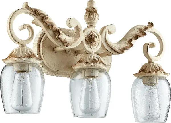The Florence 3-Light Vanity brings quintessential antique luxury to your bathroom with rustic candle sleeves, classic bobeches, and intricate leaf designs. Perfect for traditional and French Country interiors seeking timeless elegance.