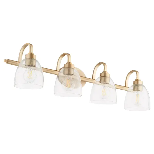 The Reyes 4-light vanity combines clean-lined elegance with transitional versatility. Its aged brass finish and clear seeded glass shades create sophisticated bathroom lighting that complements both traditional and contemporary spaces.