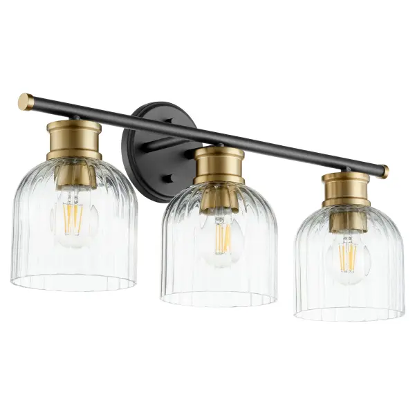 The Monarch vanity light blends contemporary design with timeless elegance through its striking black and aged brass finish combination. Clear fluted tulip glass shades provide excellent illumination while the dual-tone finish offers versatility across multiple design styles.