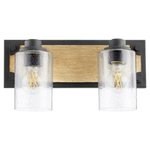 This 2-light vanity fixture delivers authentic industrial farmhouse style with its two-toned driftwood and noir finish paired with clear seeded glass shades. Perfect for creating vintage ambiance while providing practical task lighting.