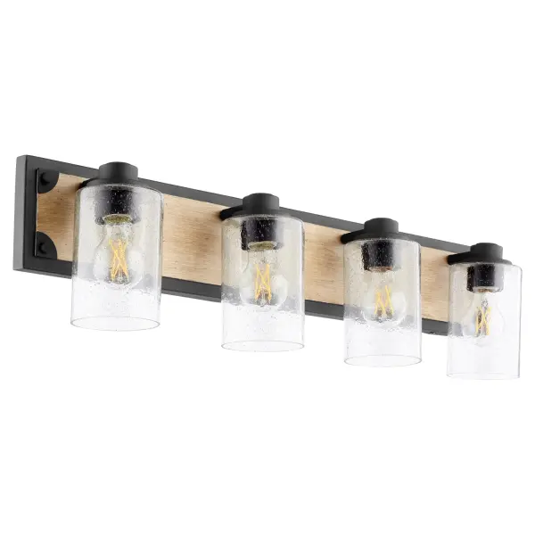 This 4-light vanity fixture combines rustic farmhouse appeal with industrial edge through its two-toned driftwood and noir finish. Clear seeded glass shades add vintage character while providing ample illumination.