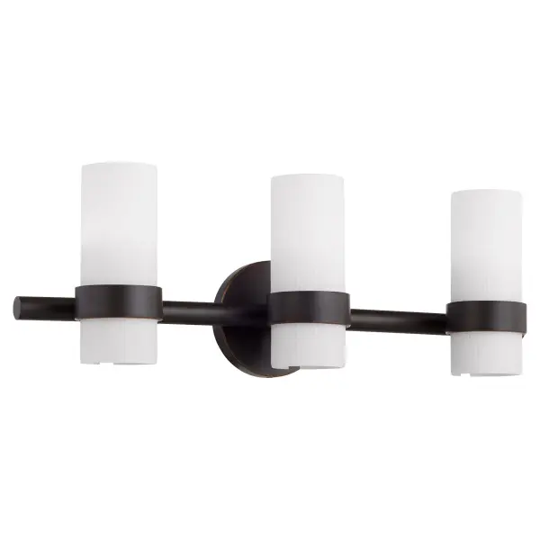 The Sojourn 3-Light Vanity masterfully combines contemporary design with nostalgic touches, featuring candle-like white milky glass pillars and a modern bobeche. Its bronze finish and transitional aesthetic make it versatile for both modern and traditional bathrooms.