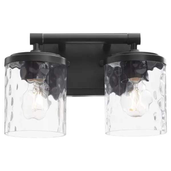 The Starky 2-Light Vanity combines traditional design elements with contemporary matte black finish. Clear hammered glass shades provide textured visual interest while delivering functional bathroom lighting. - alternate view