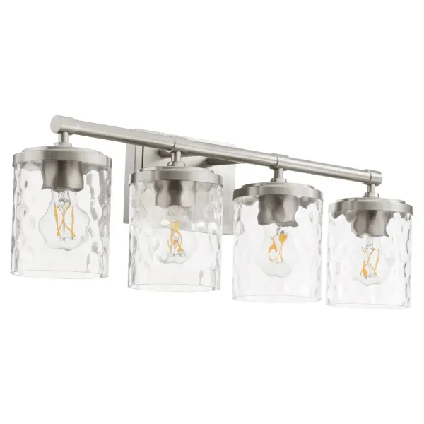 The Starky vanity light combines traditional elegance with practical illumination. Clear hammered glass shades on a satin nickel frame create visual interest while providing ample lighting for grooming tasks.