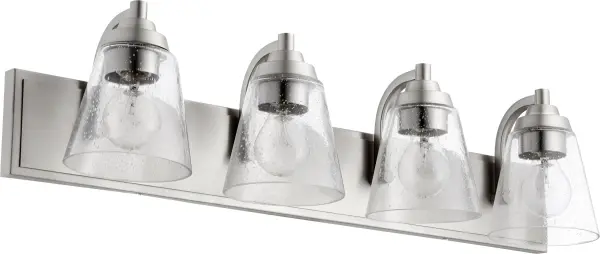 This transitional vanity light combines round elements with a rectangular backplate for a balanced aesthetic. The satin nickel finish and clear seeded glass provide timeless appeal that complements various bathroom styles.