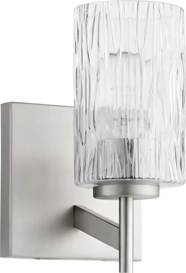 This modern wall sconce combines textured rectangular glass with a square backplate for a striking geometric aesthetic. The satin nickel finish offers versatility while the bold design makes a statement in contemporary spaces.