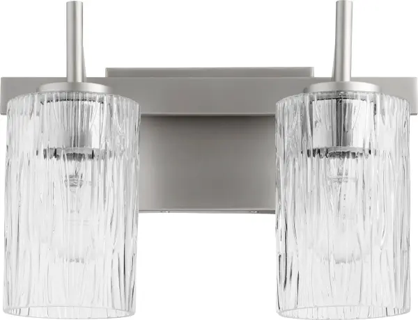 This modern vanity light combines textured rectangular glass with a clean square backplate for a sophisticated, contemporary aesthetic. The satin nickel finish offers versatile styling that complements modern bathrooms.