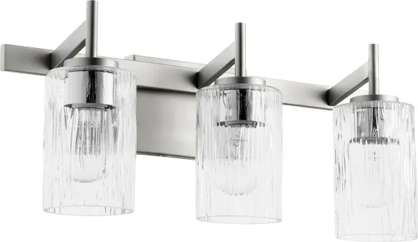 This three-light vanity fixture combines textured rectangular glass with a clean square backplate for a striking modern aesthetic. The satin nickel finish offers versatility while the contemporary design elevates bathroom spaces.