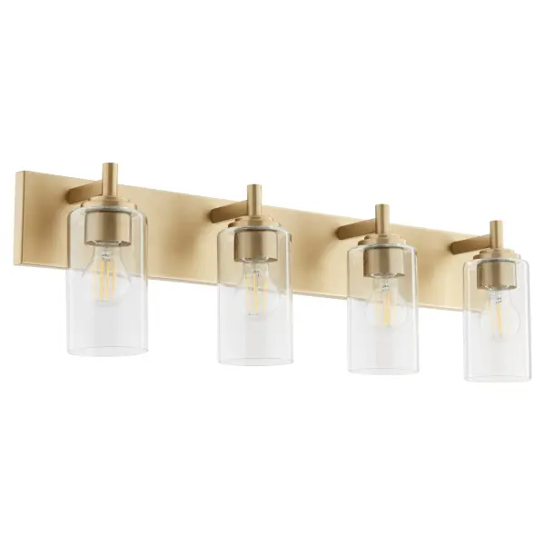 The Fallstaff 4-Light Vanity combines modern design with vintage-inspired aged brass finish. Features interchangeable socket decos in three finishes, clear glass shades, and T-shaped arms for customizable style and ample illumination.