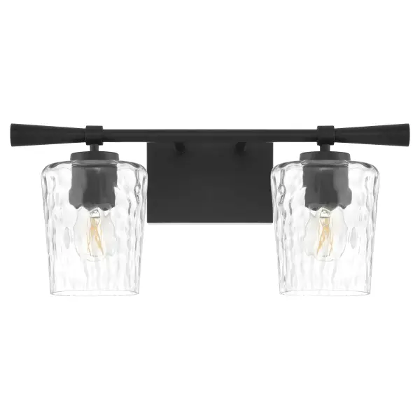 The Goodwin 2-Light Vanity combines industrial charm with transitional elegance through its clear hammered glass shades and sleek matte black frame. Perfect for bathrooms seeking a sophisticated yet approachable aesthetic.
