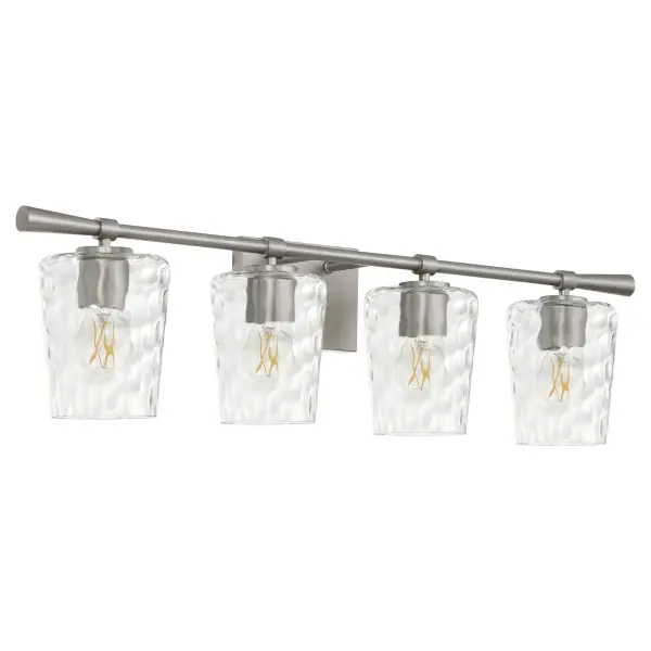 The Goodwin 4-Light Vanity combines sleek metal framing with distinctive hammered glass shades for a sophisticated bathroom lighting solution. Its transitional design bridges traditional and modern aesthetics.