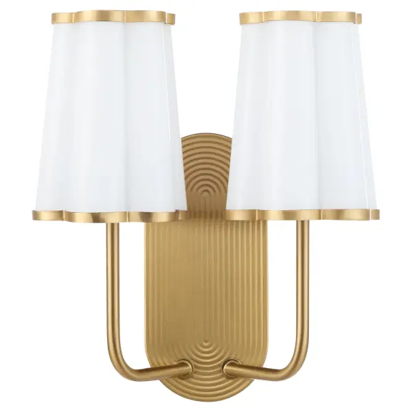 The Belinder 2-light wall sconce brings Tamara Day's signature relaxed luxury aesthetic to life with scalloped glass shades and a subtly ribbed backplate. The aged brass finish adds warmth and sophistication, perfect for elevating bathrooms, hallways, and bedrooms with modern yet timeless appeal.