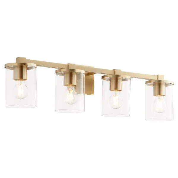 The Bolton vanity light combines crisp angles and clean details with aged brass finish and clear cylindrical glass shades. Perfect for modern bathrooms seeking sophisticated illumination with contemporary flair. - alternate view