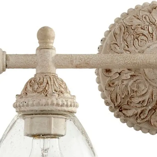 This 2-light vanity fixture combines Persian White finish with clear seeded glass for a refined, traditional aesthetic. Perfect for creating cohesive bathroom lighting across multiple spaces with elegant detailing. - alternate view