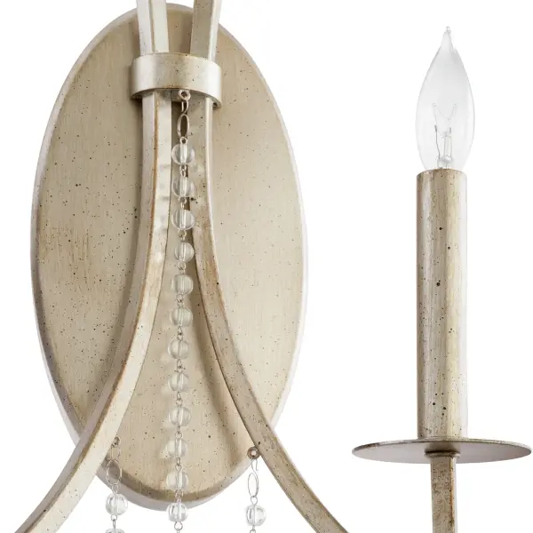The Malin wall sconce combines aged silver leaf frames with draped crystal beads for sophisticated lighting. Clear beads and classic crystals create stunning light refraction while soft curves balance angular details. - alternate view