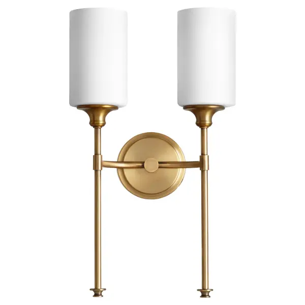 The Celeste 2-light wall sconce combines aged brass warmth with satin opal glass for a sophisticated, modern look. Its clean lines and transitional design make it adaptable to various interior styles.
