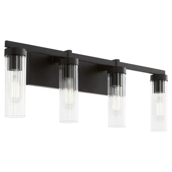 The Kilbey 4-Light Vanity combines industrial aesthetics with refined details through its clear fluted glass shades and matte black finish. Perfect for modern bathrooms seeking a balance of style and function. - alternate view