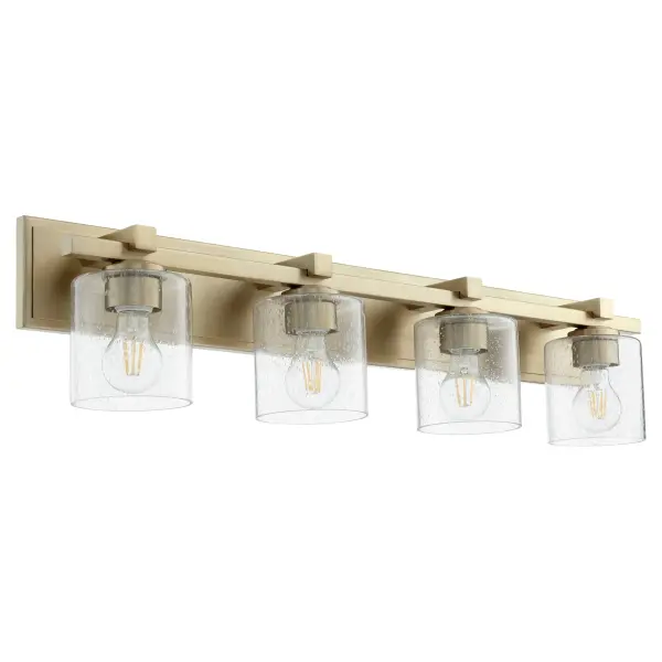 This 4-light vanity fixture combines timeless elegance with contemporary appeal. The aged brass finish and clear seeded glass shades create ambient lighting perfect for bathroom mirrors while adding sophisticated style.