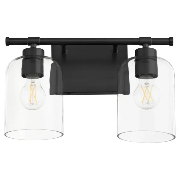 The Tribute 2-Light Vanity combines timeless design with contemporary matte black finish. Clear glass shades and smooth curves create an effortless aesthetic suitable for both indoor and outdoor applications.