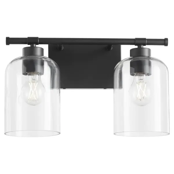 The Tribute 2-Light Vanity combines timeless design with contemporary matte black finish. Clear glass shades and smooth curves create an effortless aesthetic suitable for both indoor and outdoor applications. - alternate view