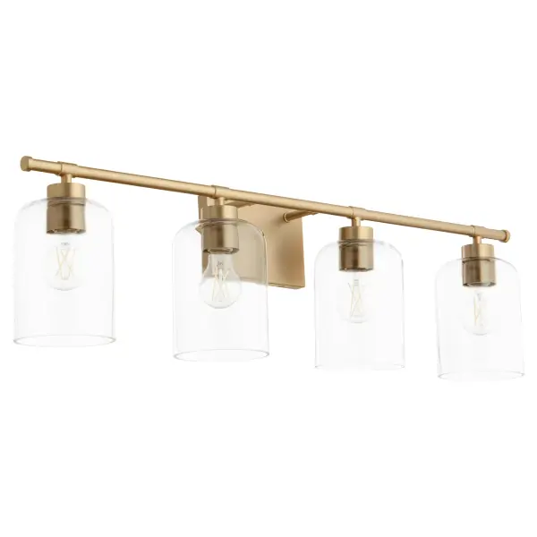 The Tribute vanity light combines timeless design with contemporary sensibility. Clear glass shades on a linear aged brass frame create an effortless aesthetic suitable for both indoor and outdoor use.
