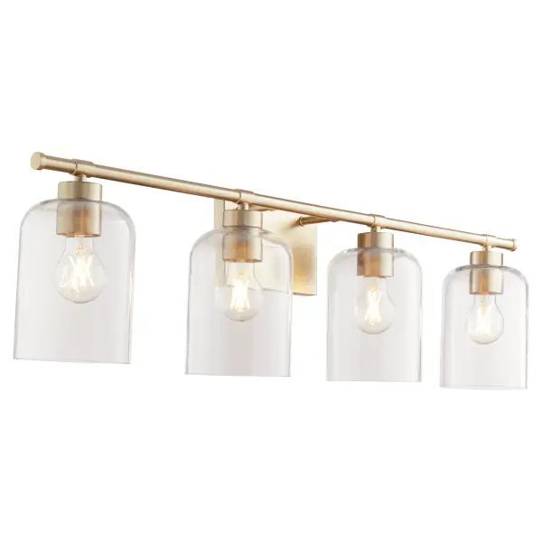 The Tribute vanity light combines timeless design with contemporary sensibility. Clear glass shades on a linear aged brass frame create an effortless aesthetic suitable for both indoor and outdoor use. - alternate view