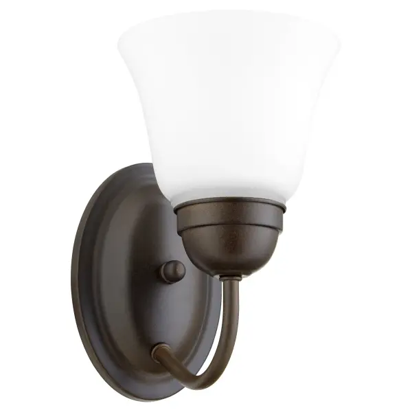 This elegant single-light wall sconce combines graceful round elements with classic detailing in a warm Oiled Bronze finish. Perfect for adding ambient lighting and traditional charm to hallways, bedrooms, and bathrooms.