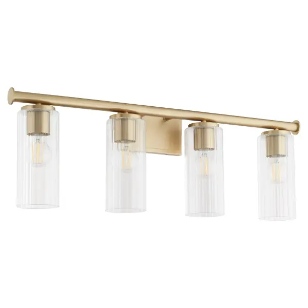 The Mercier 4-Light Vanity brings French chateau elegance to bathroom lighting with cylindrical disc details and slender clear glass shades. Its aged brass finish and clean silhouette create a luxurious, masculine aesthetic.