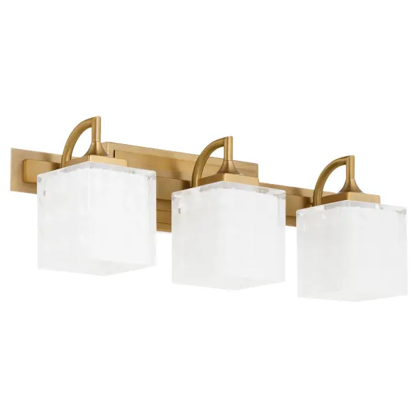 The Diamonte vanity light combines contemporary square shades with elegant case glass for a sophisticated bathroom lighting solution. Its brushed brass finish adds warmth while the dual-mount capability allows upward or downward installation.