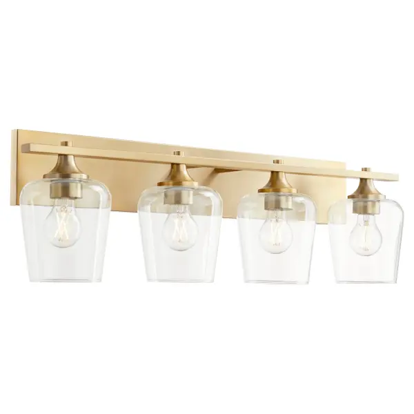 The Veno 4-Light Vanity combines angular metal frames with clear glass shades for traditional bathroom elegance. The aged brass finish adds warmth and sophistication, perfect for creating a classic yet comfortable atmosphere. - alternate view