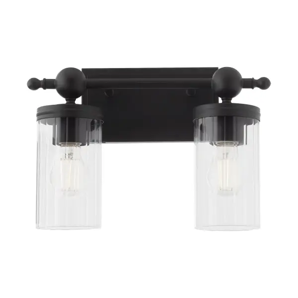 The Lee Boulevard 2-Light Vanity blends traditional design with contemporary spherical details and vertically-fluted clear glass shades. Inspired by a Kansas City countryside home, it offers luxurious transitional comfort in matte black. - alternate view