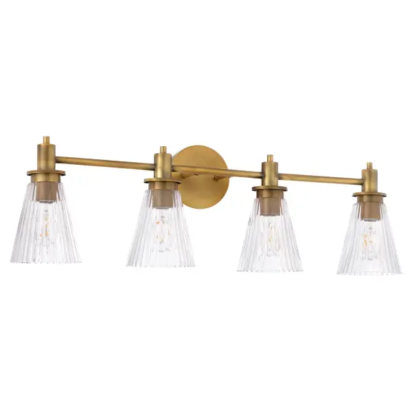 The Lawton 4-Light Vanity combines transitional charm with contemporary finishing. Featuring distinctive pleated conical glass shades and ramped arms, this brushed brass fixture adds warmth and sophistication to bathroom spaces.