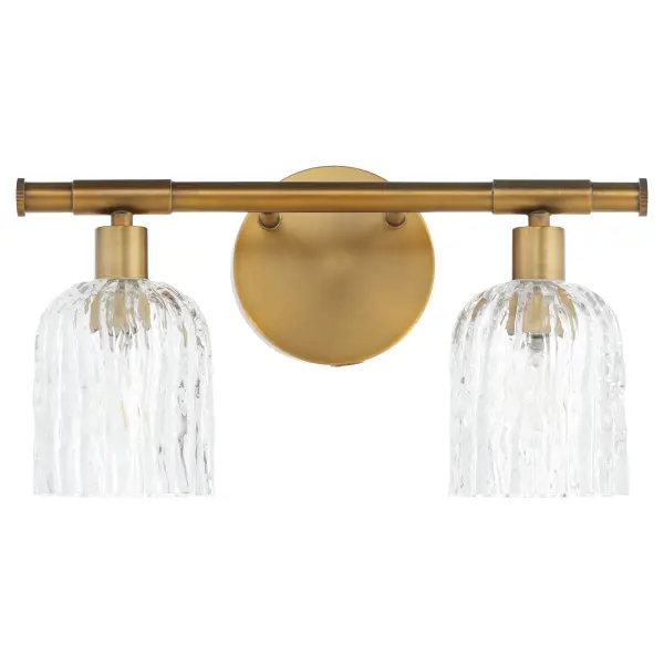 The Meriam 2-Light Wall Sconce brings Regency-era luxury to modern spaces with its brushed brass finish and unfiltered glass. Perfect for creating a cohesive look across transitional or traditional interiors.