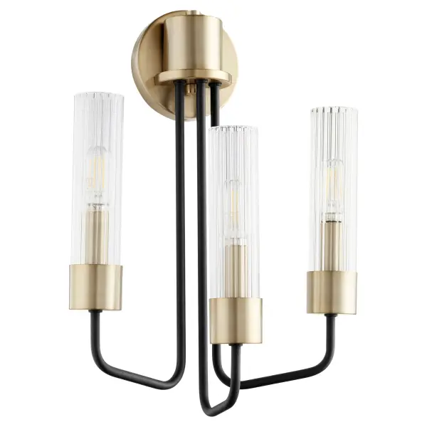 The Helix 3-Light Wall Sconce combines minimalist design with mid-century modern aesthetics. Its linear frame features soft angular curves, complemented by a sophisticated two-tone Aged Brass and Noir finish with clear fluted glass shades.