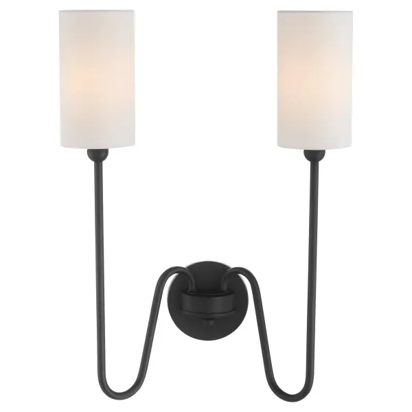The Charlotte 2-Light Wall Sconce blends classic silhouettes with modern curves, featuring clear glass cylindrical shades and a refined matte black finish. Designed by Tamara Day, it embodies 'laid back luxe' style. - alternate view