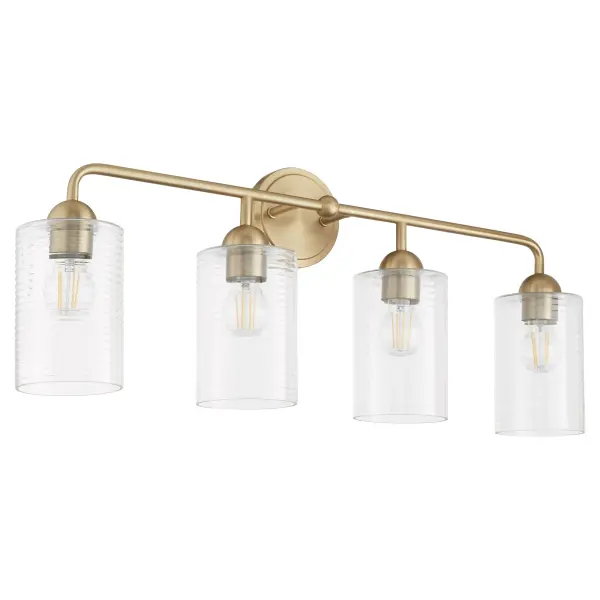The Charlotte 4-Light Vanity brings Tamara Day's 'laid back luxe' design philosophy to your bathroom with its perfect blend of classic form and contemporary details. Clear glass cylinders and aged brass finish create a warm, inviting glow.