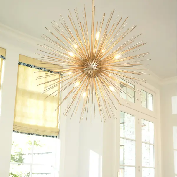 The Electra pendant delivers show-stopping visual impact with its explosive sunburst design and luxurious Gold Leaf finish. Ten candelabra lights radiate from the center, creating a sculptural focal point perfect for grand spaces. - alternate view