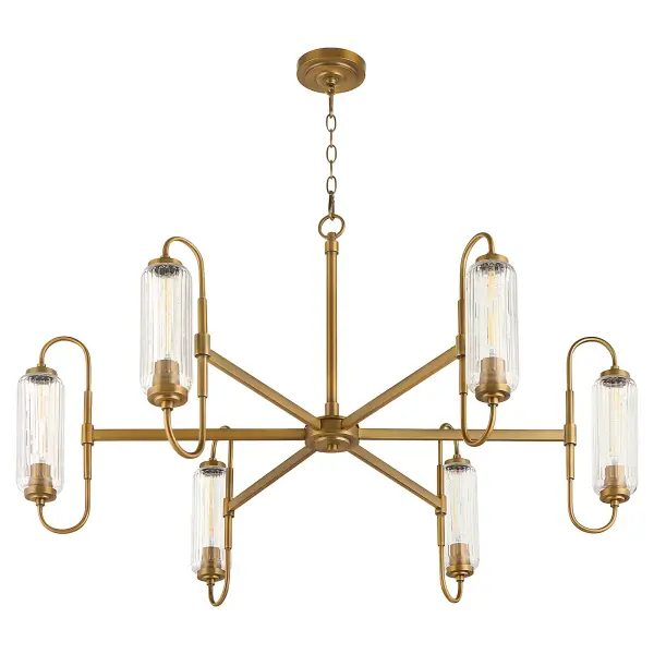 The Whitmire chandelier beautifully merges modern sophistication with vintage radio-era aesthetics. Clear ribbed glass shades and brushed brass finish create a striking centerpiece that honors tradition while embracing contemporary design.