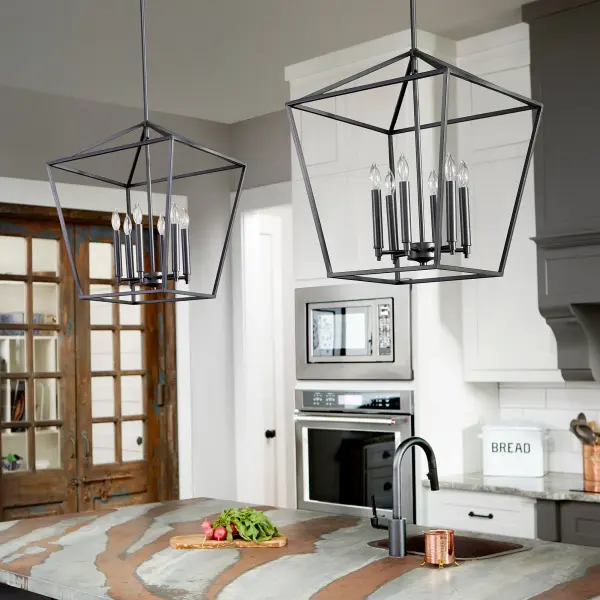 The Gabriel 6-light pendant delivers minimal elegance with exceptional versatility. Its Noir finish and clean lines work across multiple aesthetics, while included Satin Nickel and Aged Brass candle sleeves allow customization. - alternate view