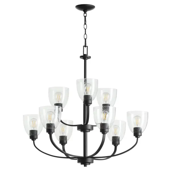 The Reyes 9-light chandelier combines sleek textured black finish with clear seeded glass for a sophisticated transitional look. Its clean-lined design blends seamlessly with various aesthetics while making a statement.