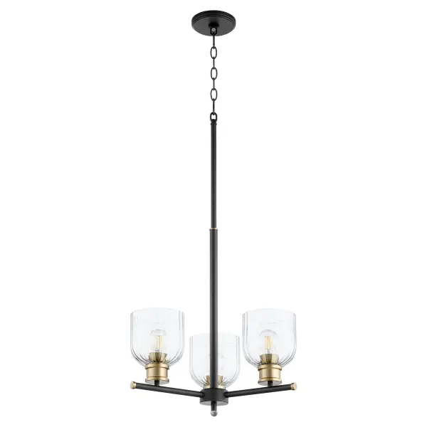 The Monarch chandelier offers exceptional versatility with its striking black and aged brass finish combination. Clear fluted glass shades and sharp-angled arms create visual interest while maintaining timeless appeal across multiple design styles.