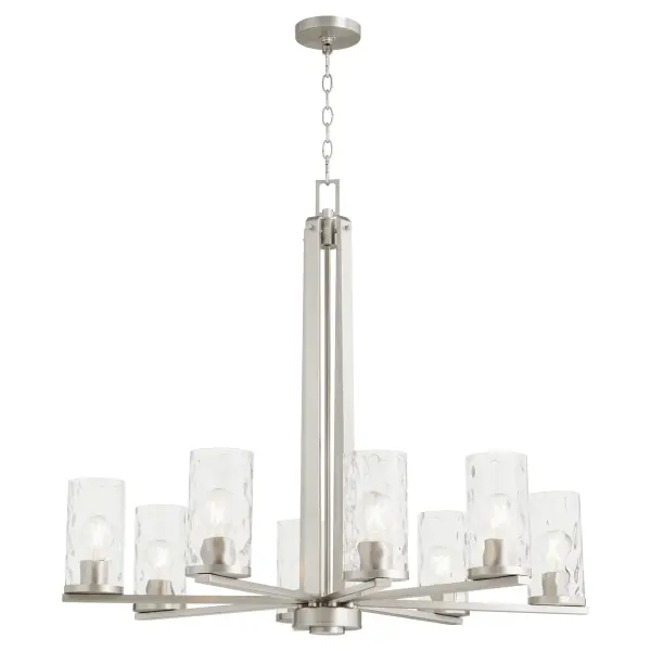 The Steinway chandelier brings soft contemporary elegance with its distinctive clear hammered glass shades and refined satin nickel finish. Eight lights provide ample illumination while the textured glass creates beautiful light diffusion. - alternate view