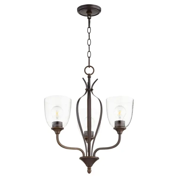 The Jardin chandelier combines intricate finials and soft curves with an oiled bronze finish and opal glass shades. Its refined yet approachable design makes it versatile for various spaces, from dining rooms to bedrooms.