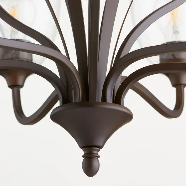 The Jardin 9-Light Chandelier combines intricate finials and soft curves with oiled bronze finish and clean opal glass shades. Its refined yet approachable design brings understated elegance to any space. - alternate view