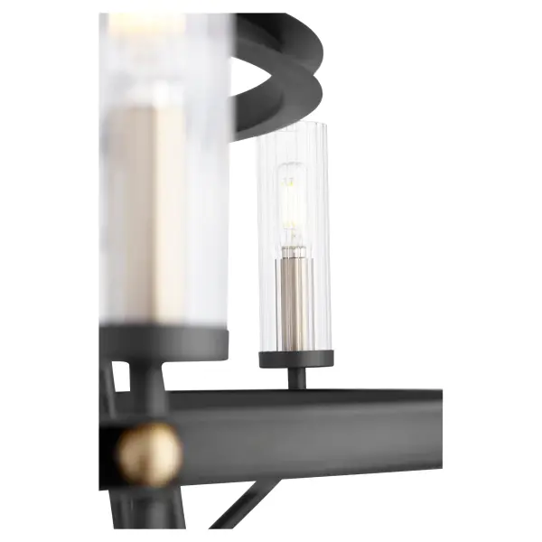 The Empire Chandelier delivers grand-scale illumination with its two-tier design and 9-light configuration. The striking black and aged brass finish combination creates visual depth while the expansive frame ensures even light distribution across large spaces. - alternate view