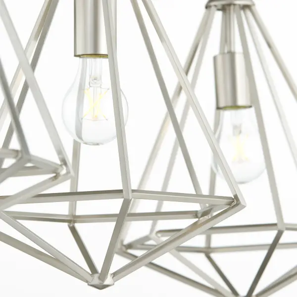 The Bennett 3-Light Island fixture blends Art Deco elegance with contemporary minimalism. Its slender metal frame and exposed bulbs create visual interest while the satin nickel finish adds sophistication to any space. - alternate view
